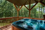 Relax in the private hot tub on the lower deck